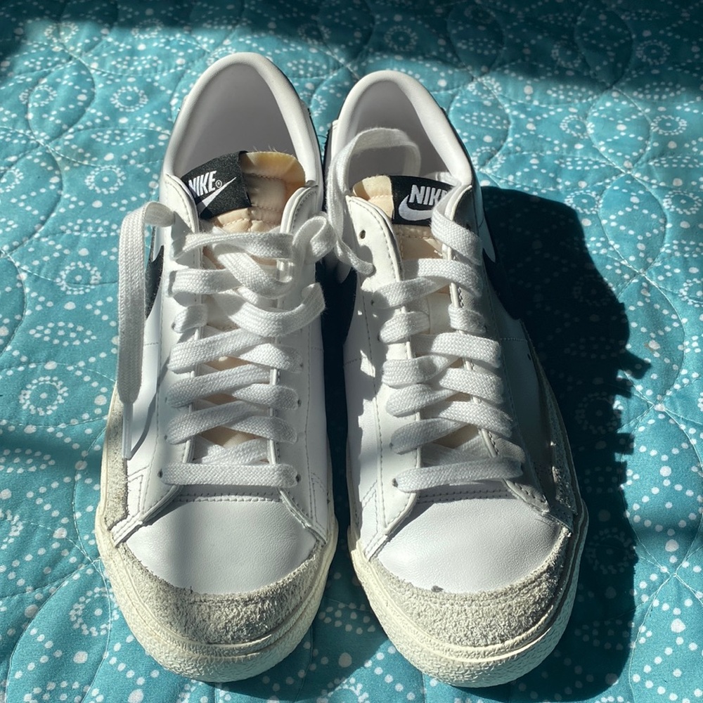 white and black nike sneakers low top blazers